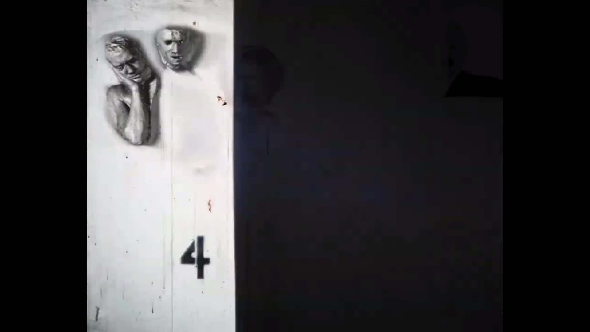 Black background. White rectangle on the left with a movie clip in black and white of a person laying down.