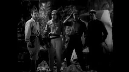 black and white movie clip of four men dressed in military uniforms