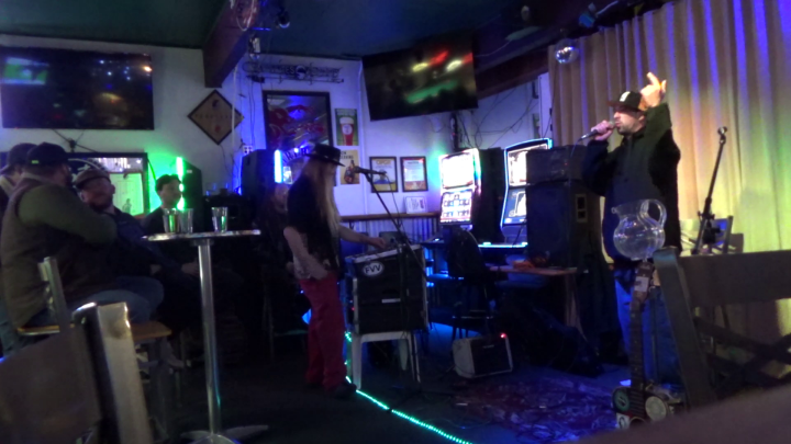 Dimly lit room with backlight and various musical instruments