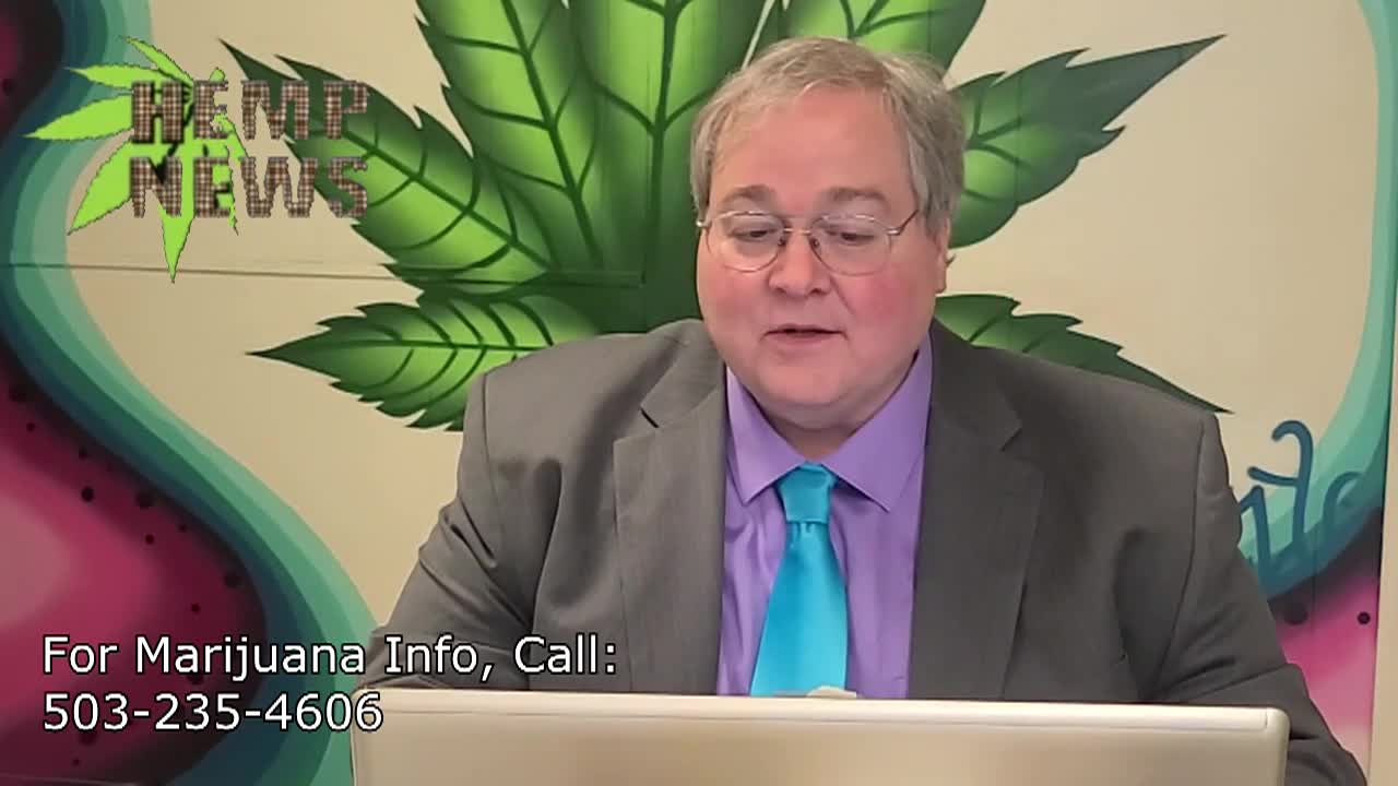 Man in a suit sitting in the center with a cannabis leaf in the background. 