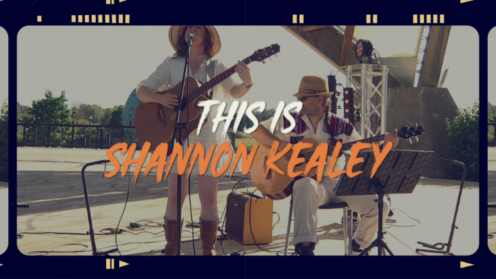 Musicians with guitars in the background. White and orange words in the center: "This is Shannon Kealey"