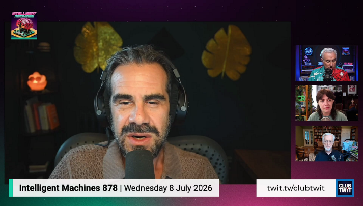 Zoom set up with a man wearing headphones in the center and a panel of three people to the right. Lower thirds at the bottom "Intelligent Machines 878 Wednesday 8 July 2026"