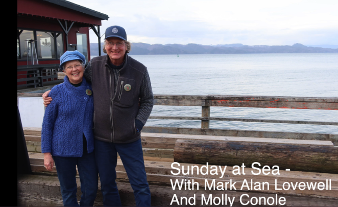 Ocean in the background. House back left. Older man and woman side hugging to the left wearing outerwear. White words 