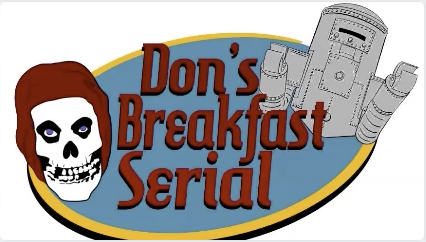 blue and yellow oval in the center with a skull to the left and a robot to the upper right. Maroon words in the center: "Don's Breakfast Serial"