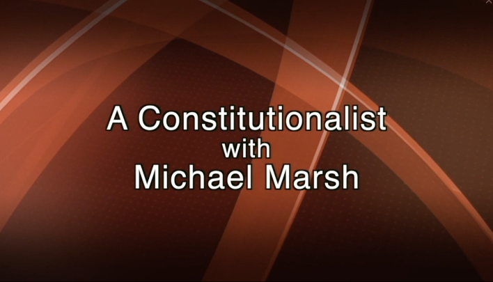 Red abstract background with white words in the center: A Constitutionalist with Michael Marsh