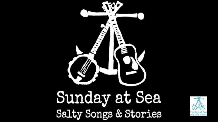 black background. A white maritime compass in the center with a banjo and guitar. White words under: "Sunday at Sea Salty Songs & Stories"