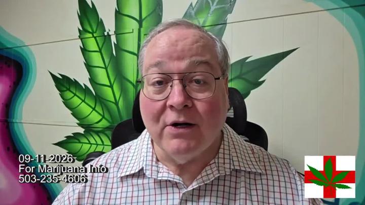 Man in a button up and glasses in the center. Brick wall with a green cannabis leaf in the background