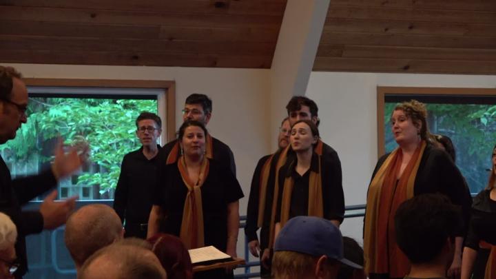 Singers in front of windows