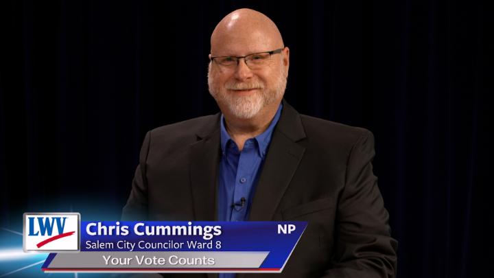 Black background. Man in a dark suit jacket and blue button up in the middle. Lower thirds to the bottom left with red, white and blue LWV logo. White words on a blue background: Chris Cummings Salem City Councilor Ward 8 Your Vote Counts NP
