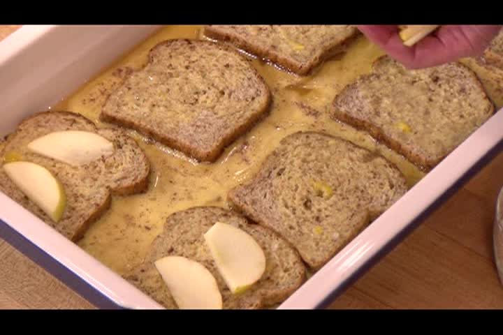 Pink sheet pan with bread and butter on it.