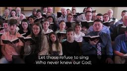 Several men and women singing hymns in a church.