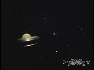 Ringed planet to the left in space