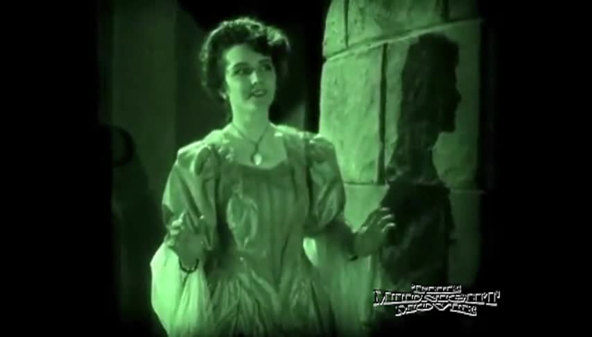 green tinted picture of a woman in an old dress